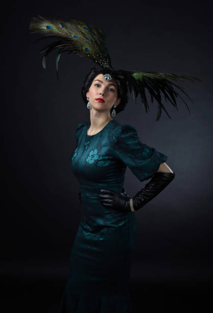 istock beautiful woman in retro style with feather decration 660112102
