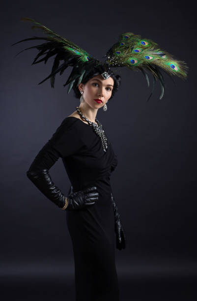 istock beautiful woman in retro style with feather decration 660117046