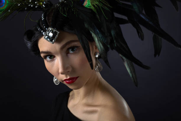 istock beautiful woman in retro style with feather decration 660117980