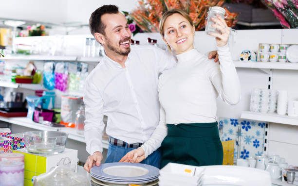 istock Man and a girl are looking for kitchen utensils 660119640
