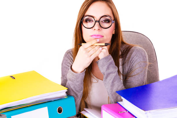 istock Woman sitting at desk in office and thinking 660132450