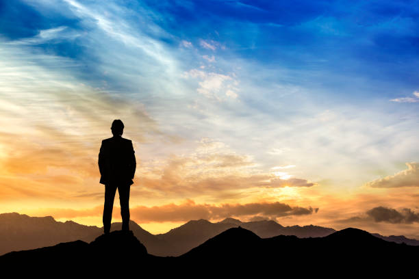 istock Businessman silhouetted against evening skies. 660132518