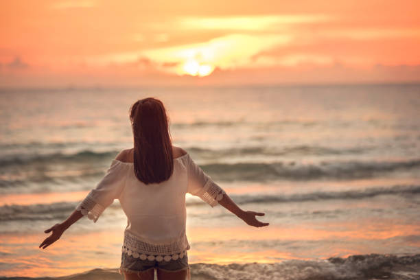istock Freedom and happiness woman on beach 660132550
