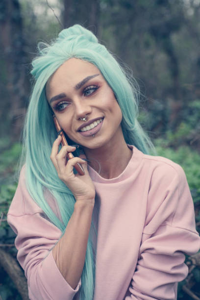 istock Girl with mint wig outdoor. 660138884