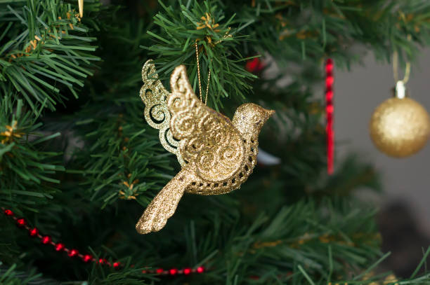istock Christmas tree toy, golden bird 660142030
