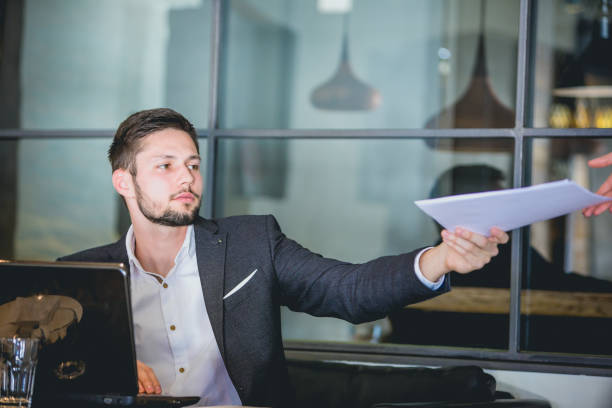 istock Handsome businessman, working on laptop, browsing some papers. 660142176