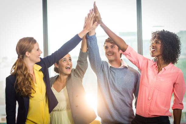 istock Business people giving high five to each other 660144782