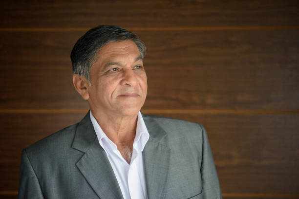 istock Senior Sri Lankan businessman in grey jacket looking away 660150708