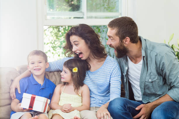 istock Son receiving surprise a gift from her parents 660153042