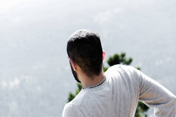 istock man coming down the mountain, close-up portrait 660153110