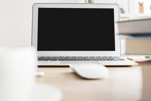 istock Wooden desktop with laptop 660153252