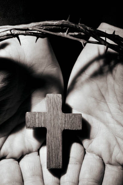 istock man with a cross and a crown of thorns 660156022