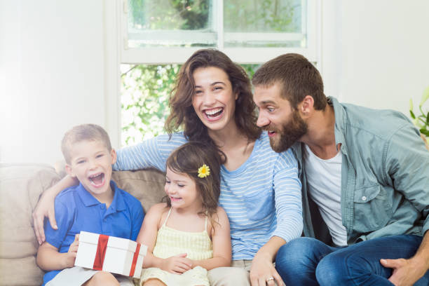 istock Son receiving surprise a gift from her parents 660160710