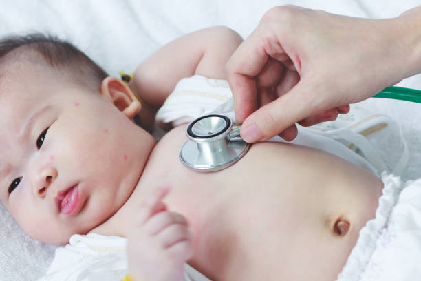 istock Pediatrician examining infant. (Two months baby asian girl) 660161542