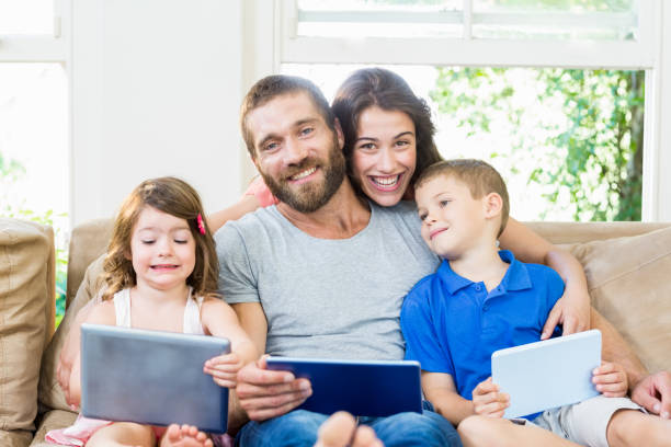 istock Parents with their kids using laptop and digital tablet 660166210