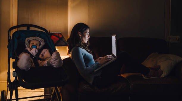 multi-tasking mother - baby mother sleeping child imagens e fotografias de stock