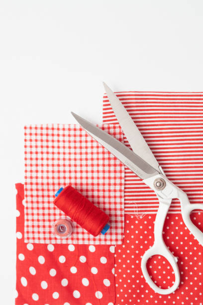 istock Sartorial scissors, pieces of colored fabric on a white background 660182704