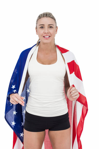 istock Female athlete with american flag on her shoulders 660207856