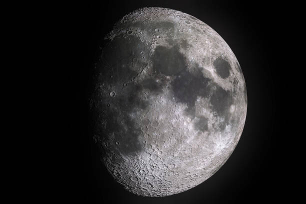 istock moon phases with light shadow of moon surface with crater on black background, universe and science 660209596