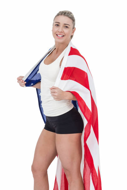 istock Female athlete with american flag on her shoulders 660211580