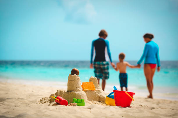 istock sand castle on tropical beach, family vacation 660211654