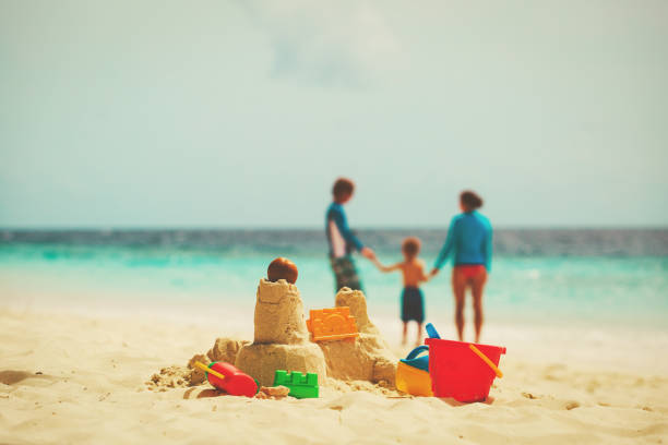 istock sand castle on tropical beach, family vacation 660213834