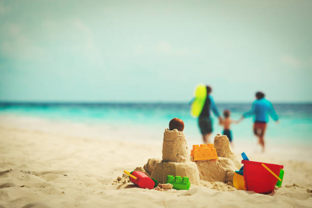 istock sand castle on tropical beach, family vacation 660215986