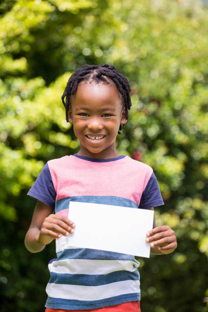 istock A little boy is holding a poster 660234786