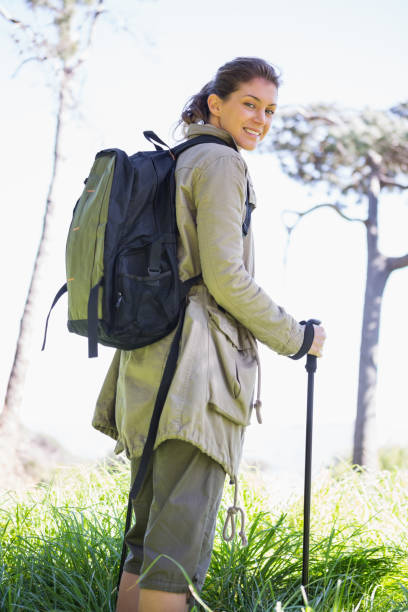 istock Woman with hiking sticks 660236016