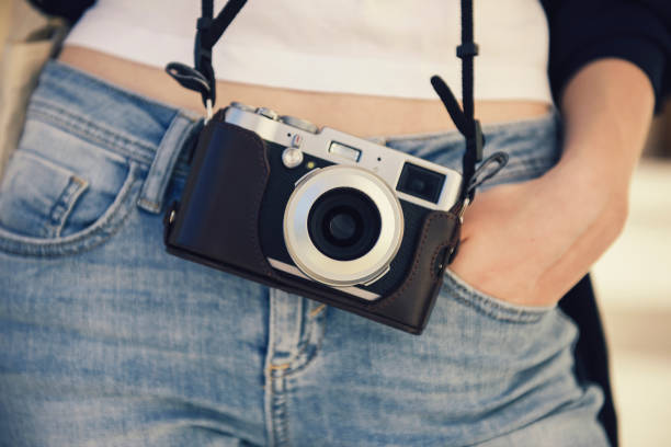 istock Girl with a vintage camera 660238920