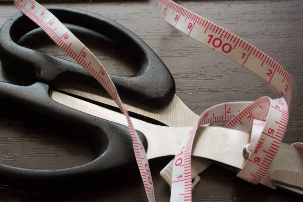 istock Tailor's Measure Tape and Scissors. 660249496