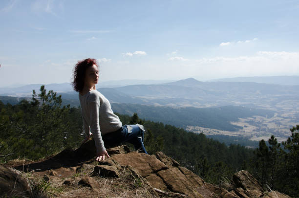 istock girl enjoying on the mountain, view from above 660251276
