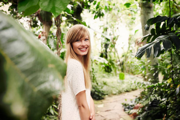 Smiling beauty in garden looking at camera