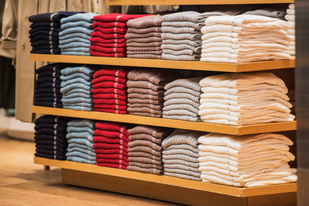 istock Stacks of clothes arranged on measure sizes in a store. 660261006