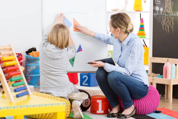 istock Girl studying maths with a teacher 660262466