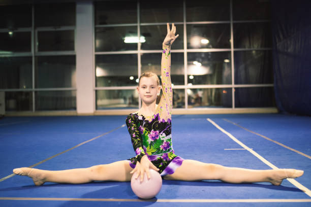 istock Girl is engaged in rhythmic gymnastics 660263602