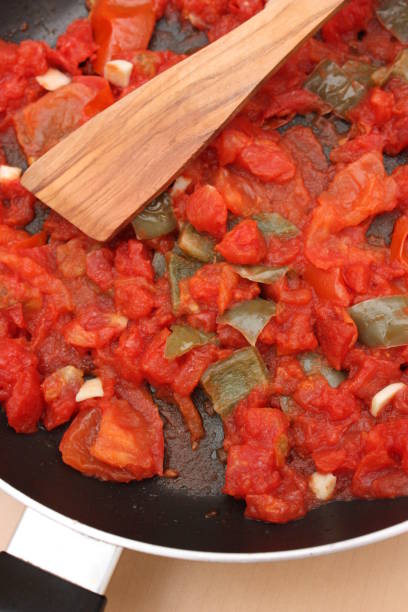 istock Pan-fried tomato and green pepper for Pizza or Salted Pie 660271810