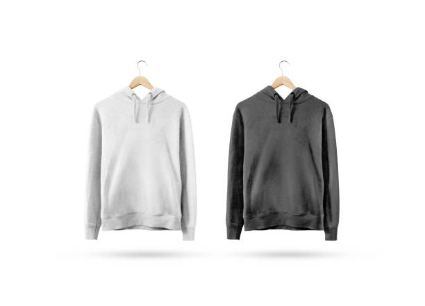 Blank black and white sweatshirt mockup hanging on wooden hanger Blank black and white sweatshirt mockup hanging on wooden hanger. Empty sweat shirt mock up on rack isolated. Clear cotton hoody template. Plain textile hoodie design. Loose overall casual jumper. coathanger stock pictures, royalty-free photos & images