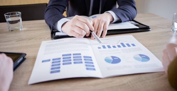 istock Banker discussing with couple 660286750