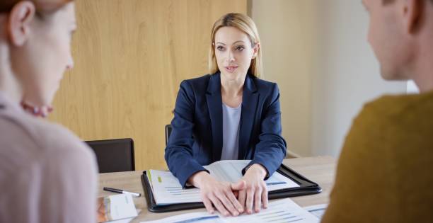 istock Insurance agent discussing with couple 660286778