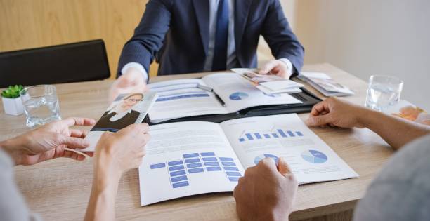 istock Banker discussing with couple 660286848