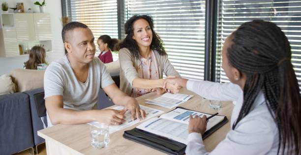 istock Women shaking hand with insurance agent 660286884
