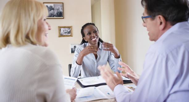 istock Insurance agent discussing with couple 660286968