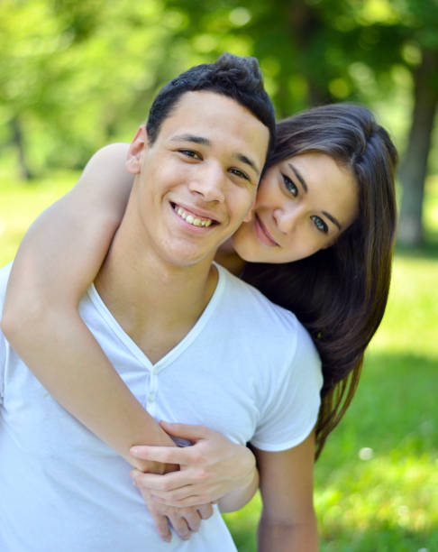 istock Couple hugging in a park 660298384