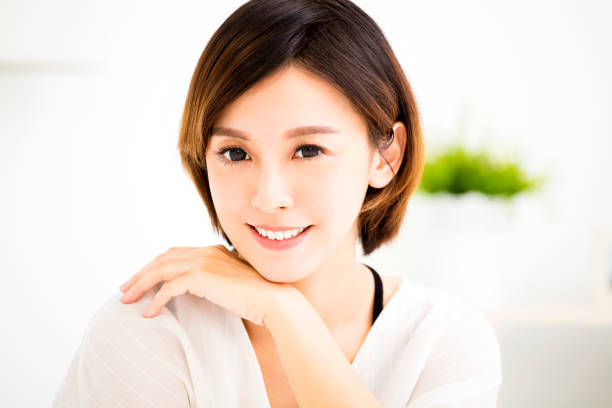 istock closeup smiling young asian woman face 660303338