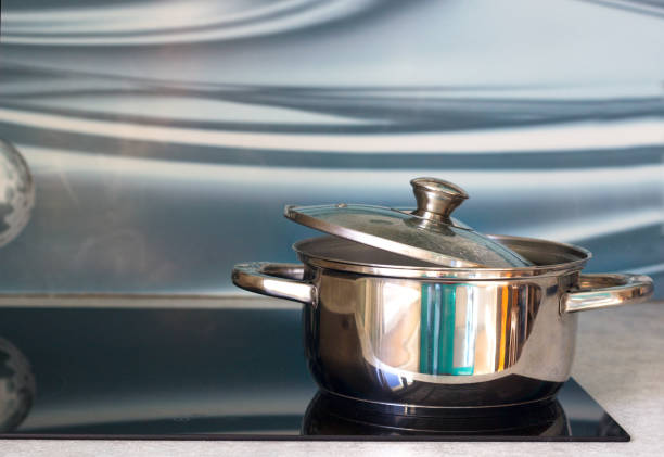 istock Big pot in modern kitchen with induction stove 660303340