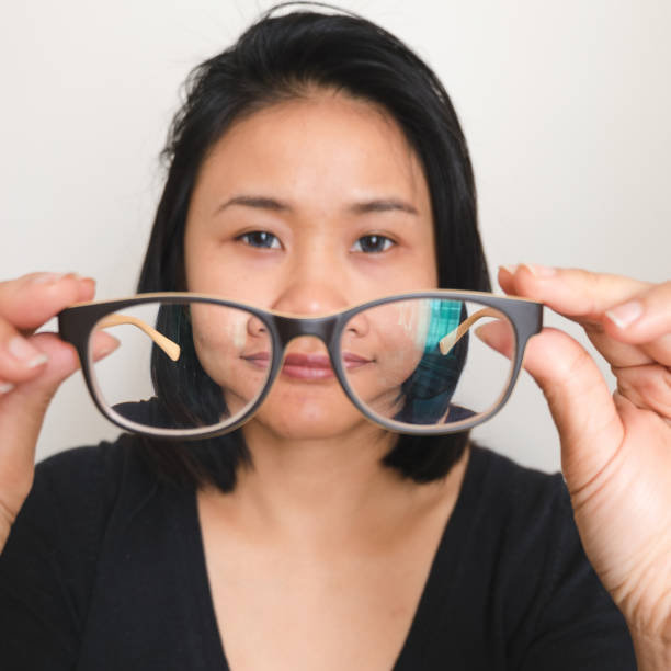 istock asian woman taking off glasses 660309040