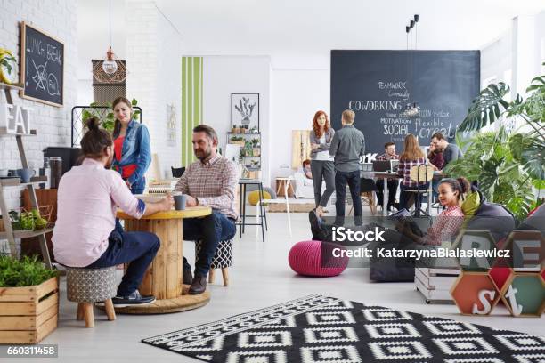 People Realxing During Lunch Break Stock Photo - Download Image Now - Office, Travel Agency, Real Estate Office