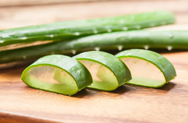 istock Aloe vera sliced on wooden background 660315918