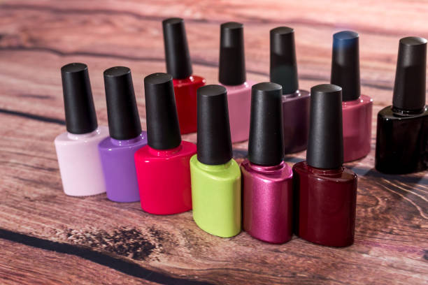 istock many nail polish bottle on desk. 660318132